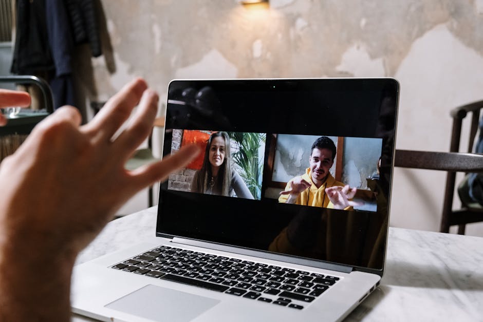 A laptop on a desk showing a recorded video call