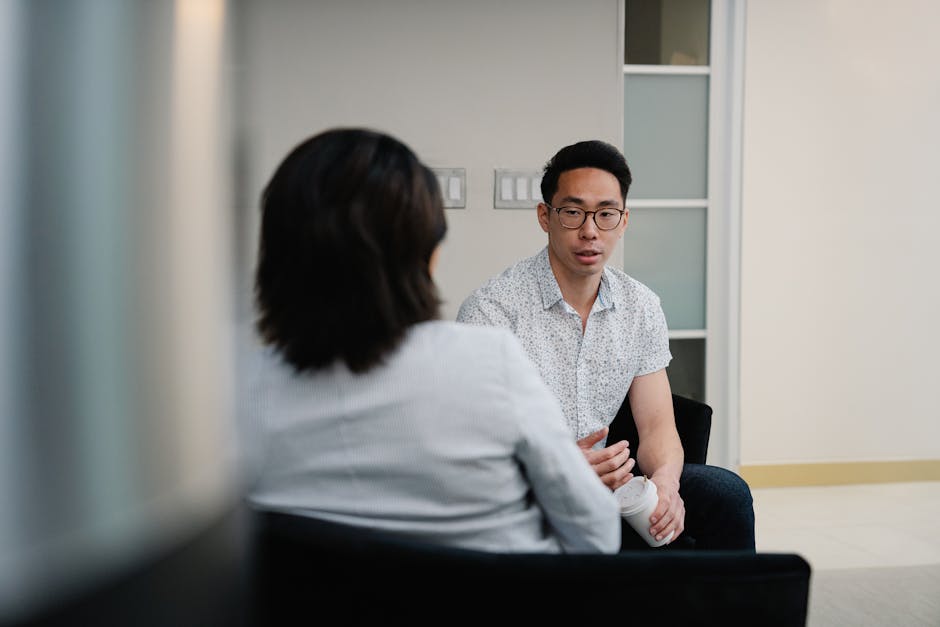 Two colleagues in a focused one-on-one conversation